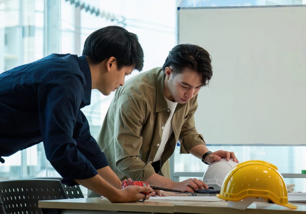 Construction and structure of engineer or architect meeting for project working with partner and tools on model building and blueprint in working site.